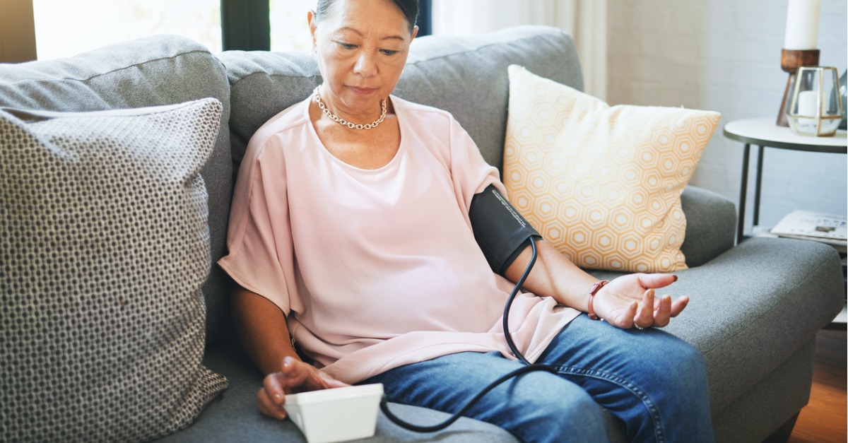 blood-pressure-healthcare-and-senior-woman-in-living-room-with-equipment-for-hypertension